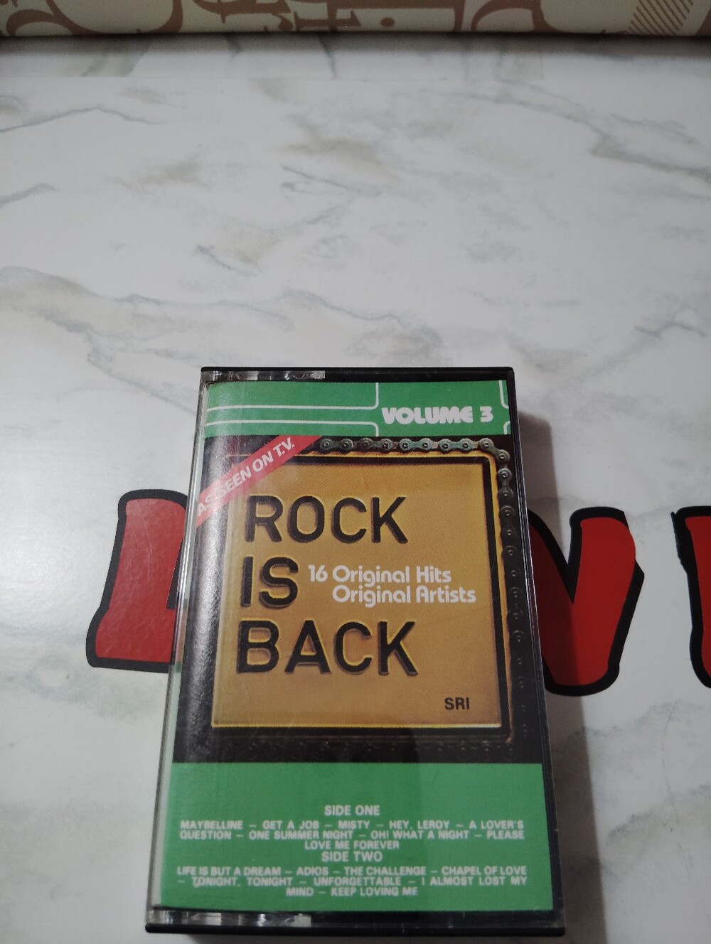 Rock Is Back Volume 3 Cassette Tape - Yellow & Green Cover